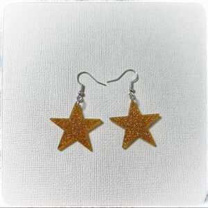 Star earrings. Gold acrylic. Brand new